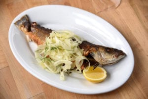 Don't miss the pan-roasted whole branzino, stuffed with fresh rosemary and topped with shaved fresh fennel.