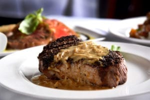 The lean, well-seasoned Kona-crusted New York strip gets an additional flavor boost with caramelized shallot butter.