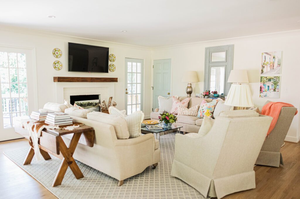Heirlooms such as the plates around the television were mixed in with Durham’s touches, which include a glass and acrylic coffee table, a custom carpet and pillows in the living room.