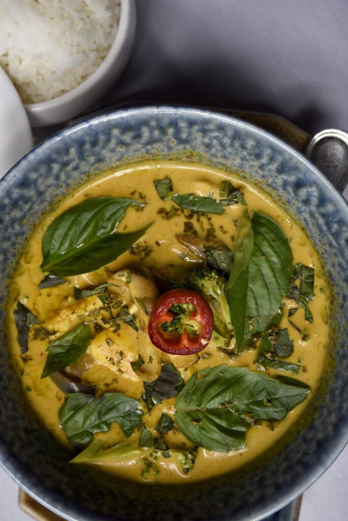 Cari ga (chicken curry) is an exceptionally executed dish, a bubbling hot bowl of pungent aromatics, finely diced sweet mango, yam, green beans and chicken.