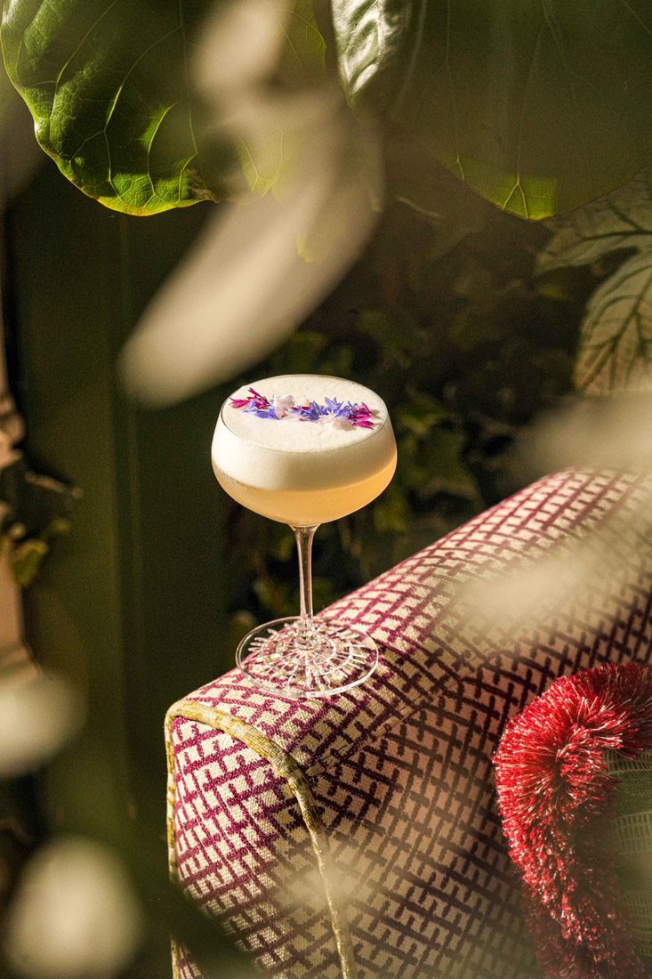 Edible flowers, fresh herbs and vibrant cocktail garnishes match the indoor garden setting of The Garden Room.