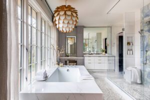 The shower's Caribbean blue marble slab, which set the tone for the primary bathroom design, was a favorite find during the designer and homeowner's first shopping trip.
