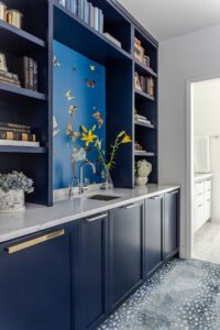 Butterflies were an important design theme in the Cavagnaros' home as seen by the wallpaper in the primary bedroom breakfast bar.