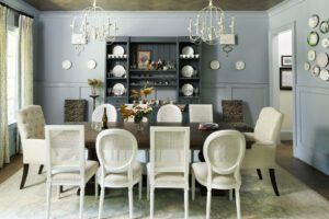 The dining room features a herringbone ceiling treatment and plate displays.