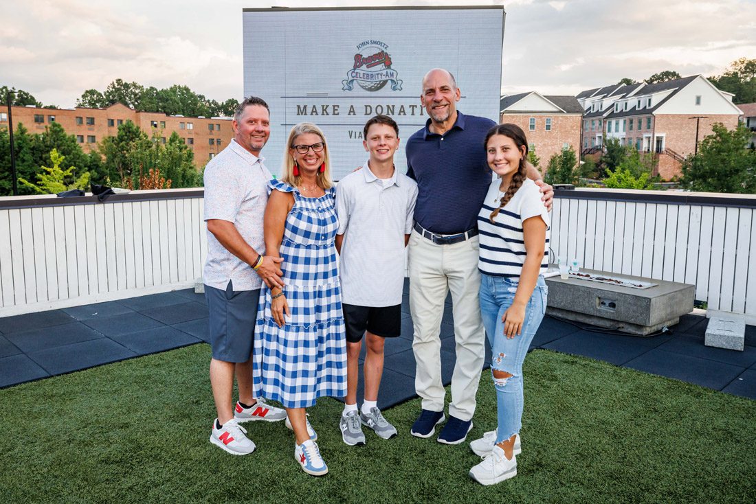 John Smoltz, (second from right) former Atlanta Braves pitcher and member of the Baseball Hall of Fame, poses at his annual golf tournament.