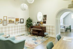 The upstairs teen suite features some of Sara Upshaw's watercolors as well as plaques Arielle and Collier have earned in their piano education.