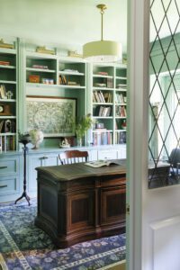 The entryway to the office features a custom lattice-pane window panel.