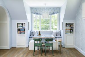 The Upshaws spend quality time as a family in the light and airy game room.