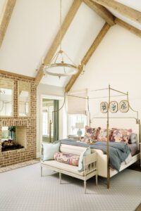The master suite's doublesided fireplace creates a cozy space in the sitting room and in bed.