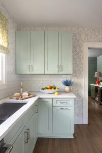 Phillip Jeffries wallpaper, a textured grasscloth, covers the kitchen walls and adds dimension.
