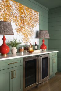 The Red lamps are an unexpected punch of color on the wet bar.