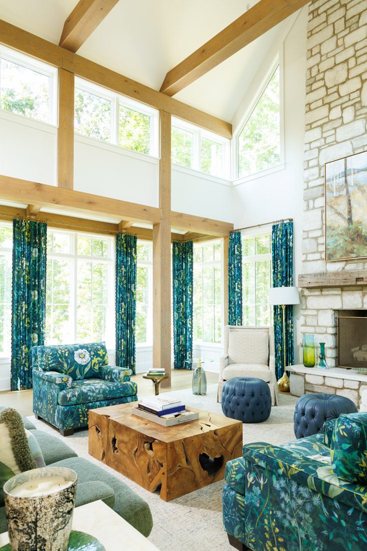Matching custom drapes and upholstery tie together the decor in the welcoming living room.