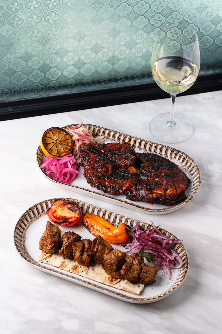 Halal meat is paired with colorful sides.