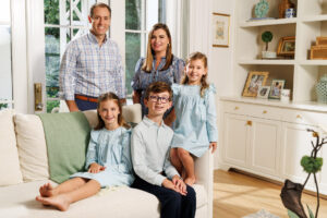 Jared and Suzanne Abram gather with their three children, ages 10, 8 and 4.