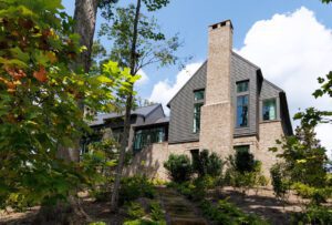 Perched on a hill, the Bullock home feels like it's tucked into a forest.