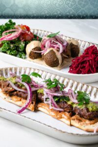 Falafel balls and lamb kebab kickstart meals with layers of bright flavors