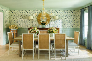 Wallpaper by Soane Britain in Dianthus Chintz greets visitors to their right as they walk in the front door and sets a tone for the spaces to come.