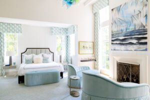 The primary bedroom sooths with calming blue hues.