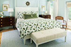 Bedding from Biscuit Home adds a colorful punch to the otherwise neutral furniture.