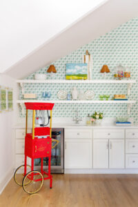 Upstairs, a game room has a kid-friendly wet bar complete with a working popcorn machine.
