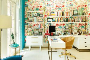 Jill's colorful office offers a view of the woodsy outdoors through French doors.