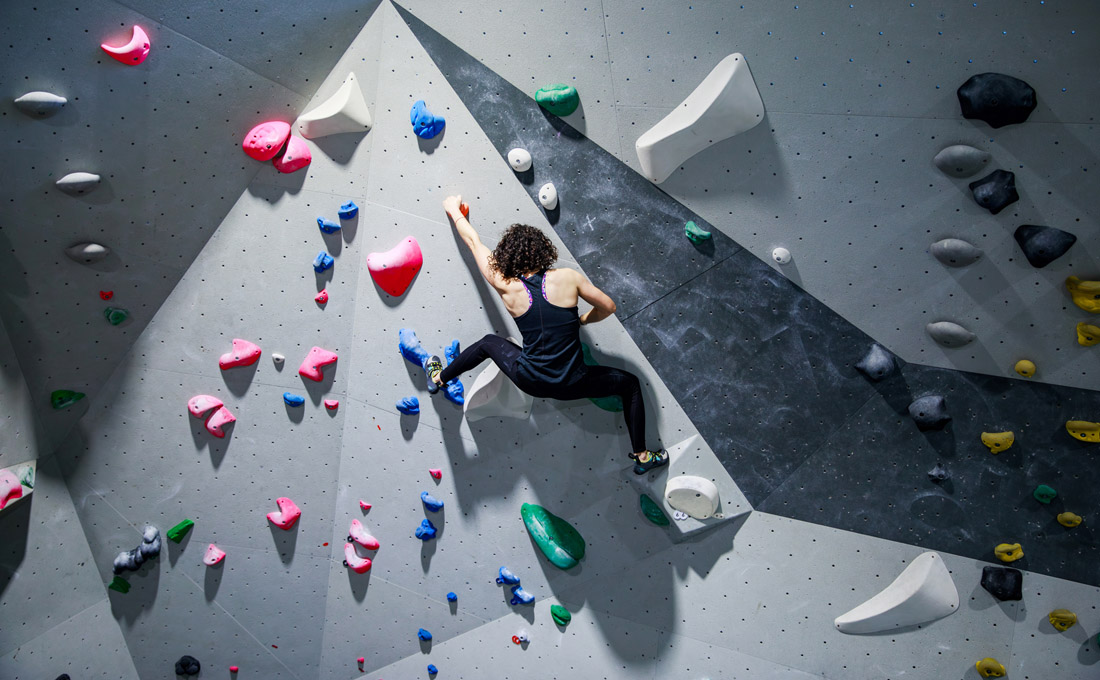Climber On Indoor Rock Wall