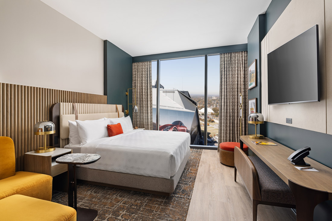 Guest rooms are done in warm autumn colors, and many offer upclose views of Mercedes-Benz Stadium.