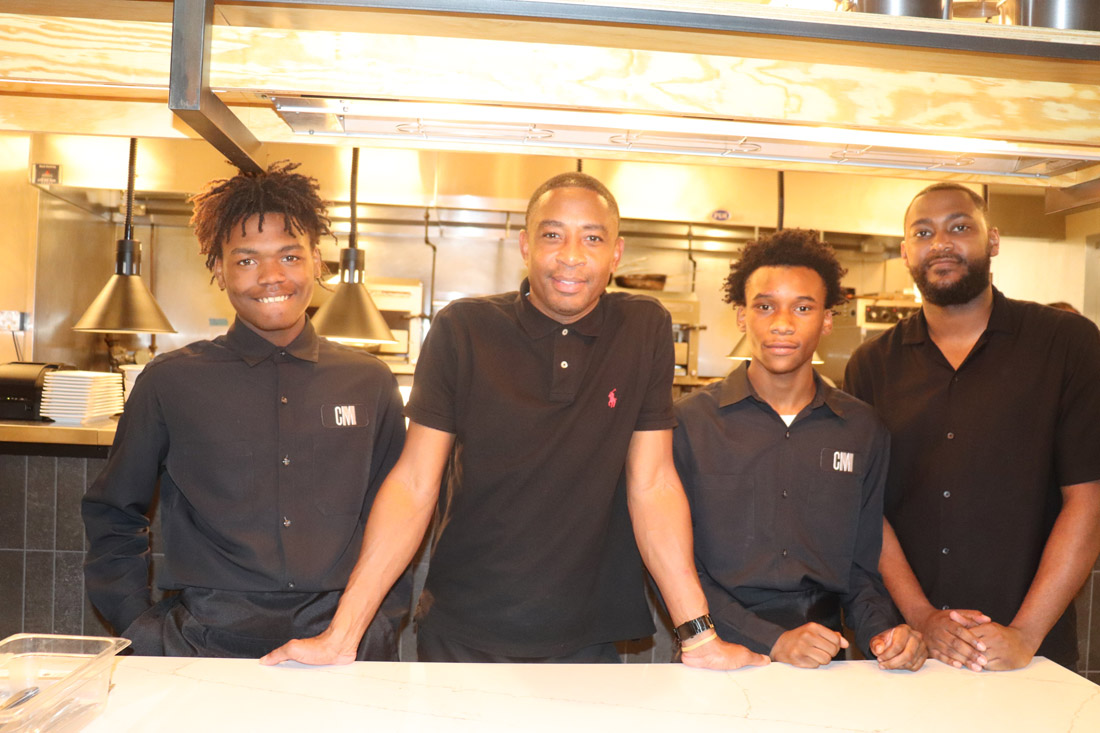 Interns at Cafe Momentum are ready for work.