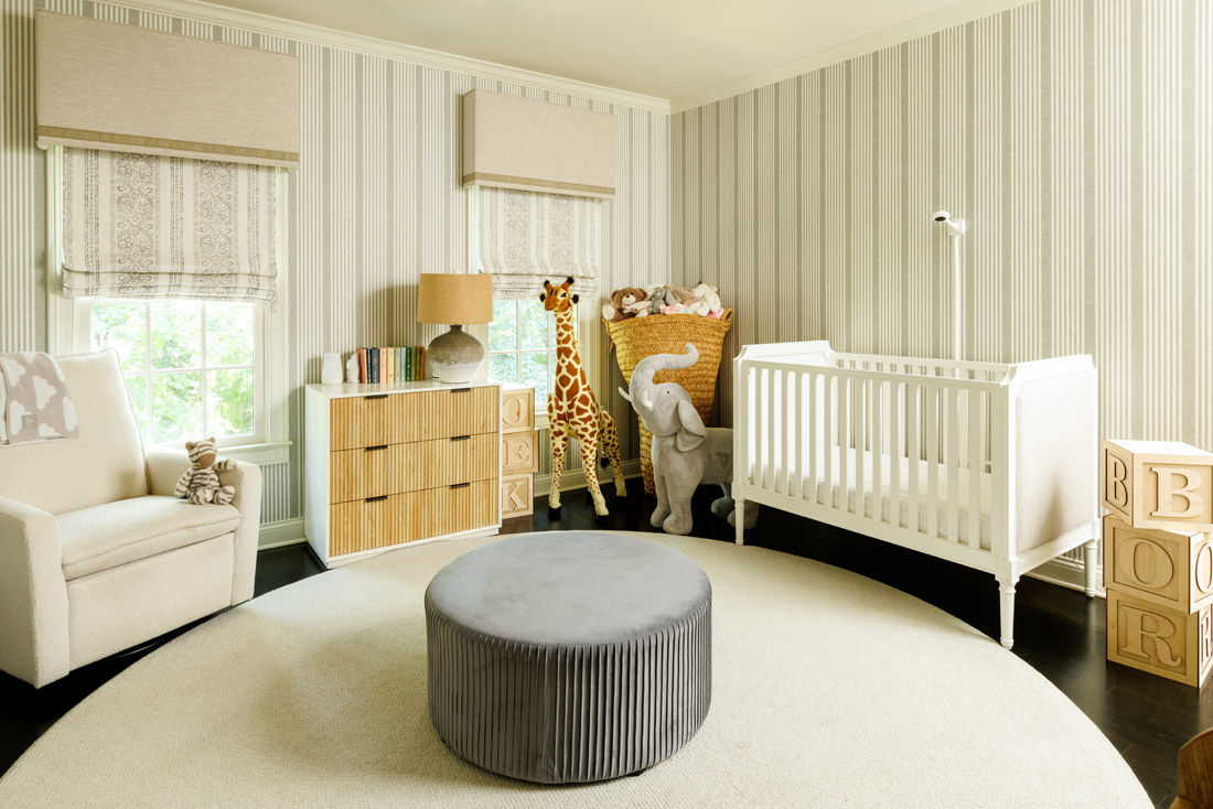 Stripes are repeated through both furniture and textiles in the nursury.